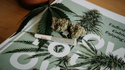 Picture of cannabis buds, a joint, and a newspaper on Ganjacy.com